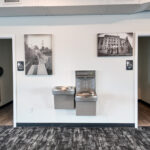 Existing men's and women's restrooms with drinking fountains in the main-level commercial space