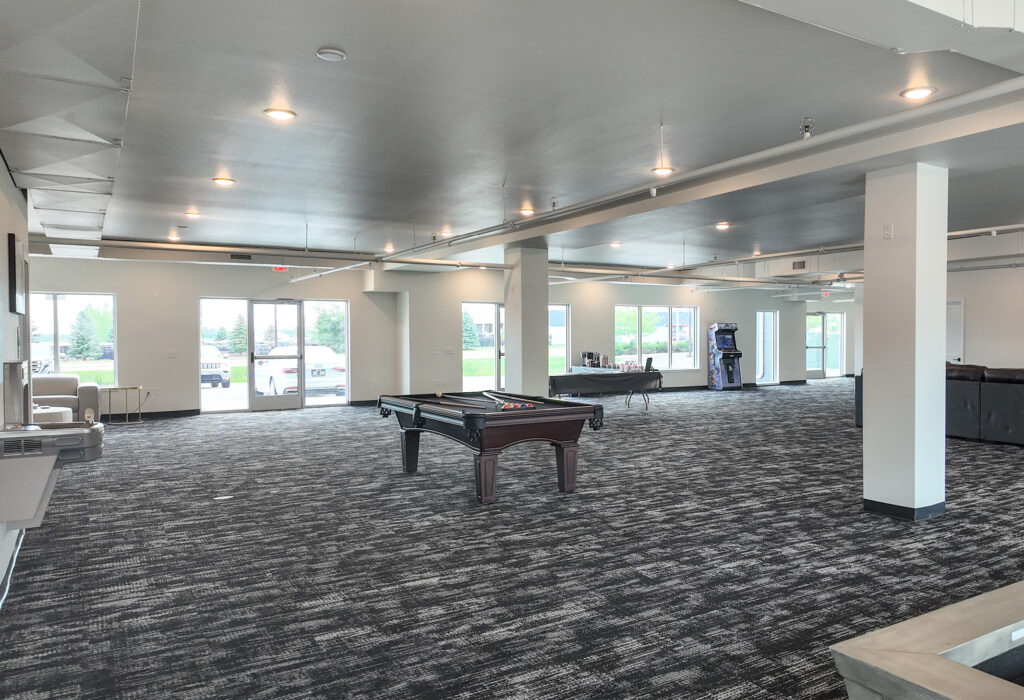 Open finished interior with storefront windows and flexible office or retail space