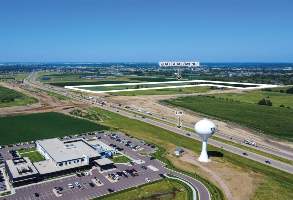 Development site east of I-29 with active 85th Street interchange construction in southwest Sioux Falls