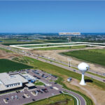 Development site east of I-29 with active 85th Street interchange construction in southwest Sioux Falls