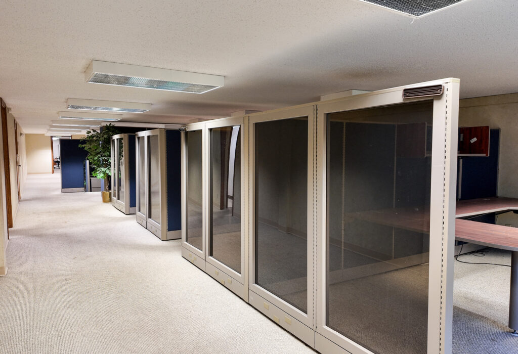 Lower-level office area with modular workstations