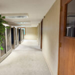 Interior hallway connecting work areas in the lower-level office suite