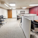 Open office area with modular workstations at the 41st Street office building