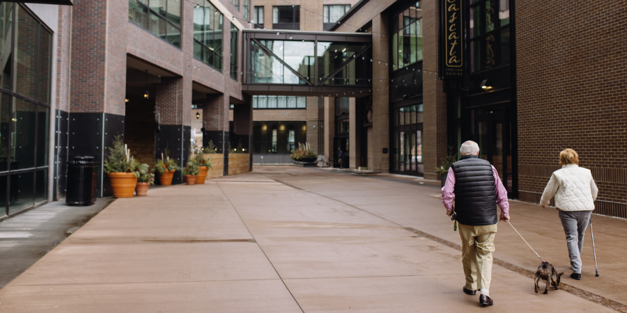 The District Lofts Couple Walking at The Steel District