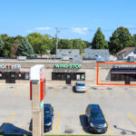 Aerial view of retail strip with available endcap suite along Minnesota Avenue