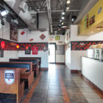 Commercial food preparation area with sinks and kitchen equipment