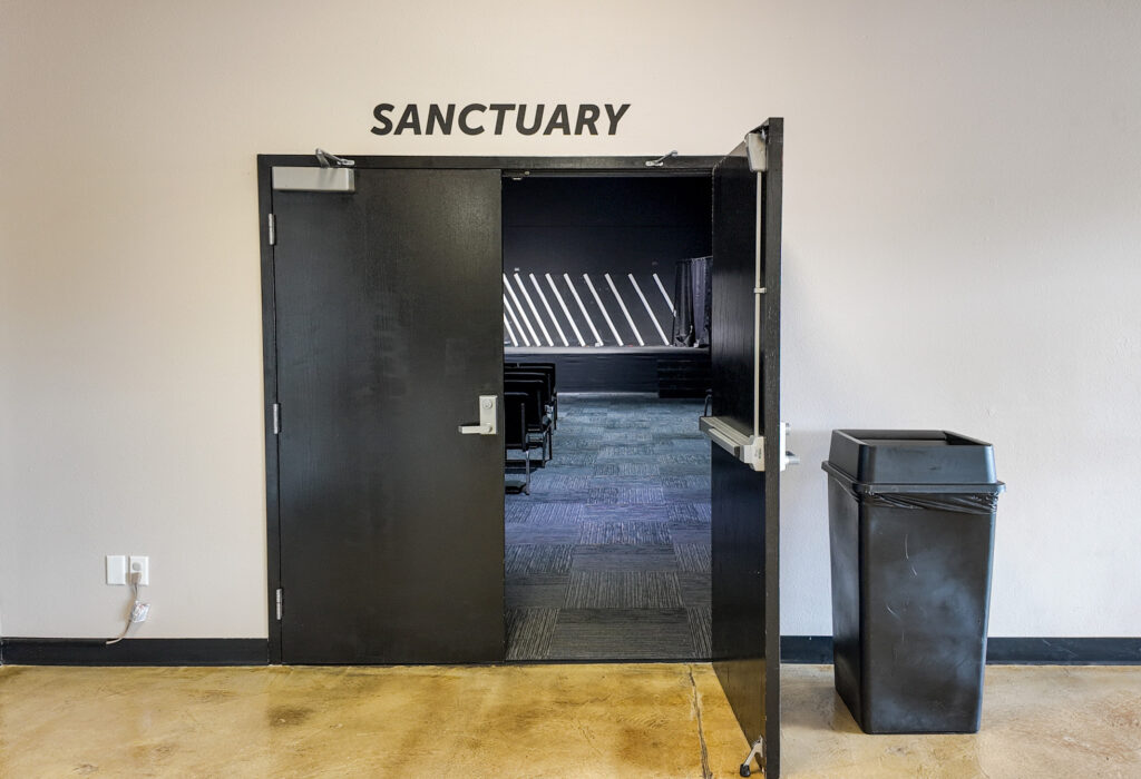 Double-door entrance from lobby into large multipurpose room