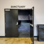 Double-door entrance from lobby into large multipurpose room