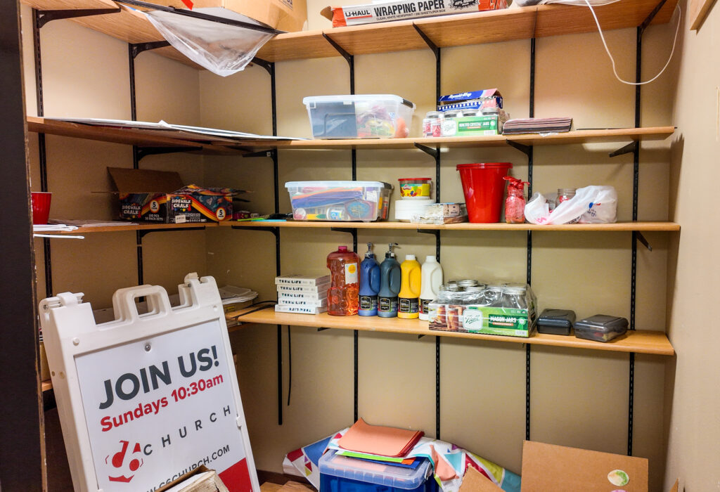Storage closet with built-in wall shelving