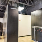 Interior corridor with restroom access and coat storage