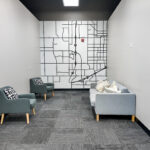 Carpeted sitting or meeting room with built-in wall map