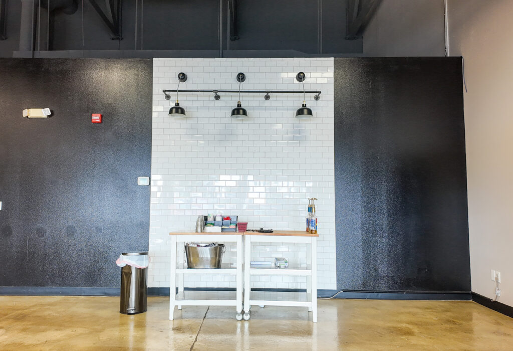 Built-in service counter with tile backsplash in open lobby area
