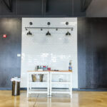 Built-in service counter with tile backsplash in open lobby area