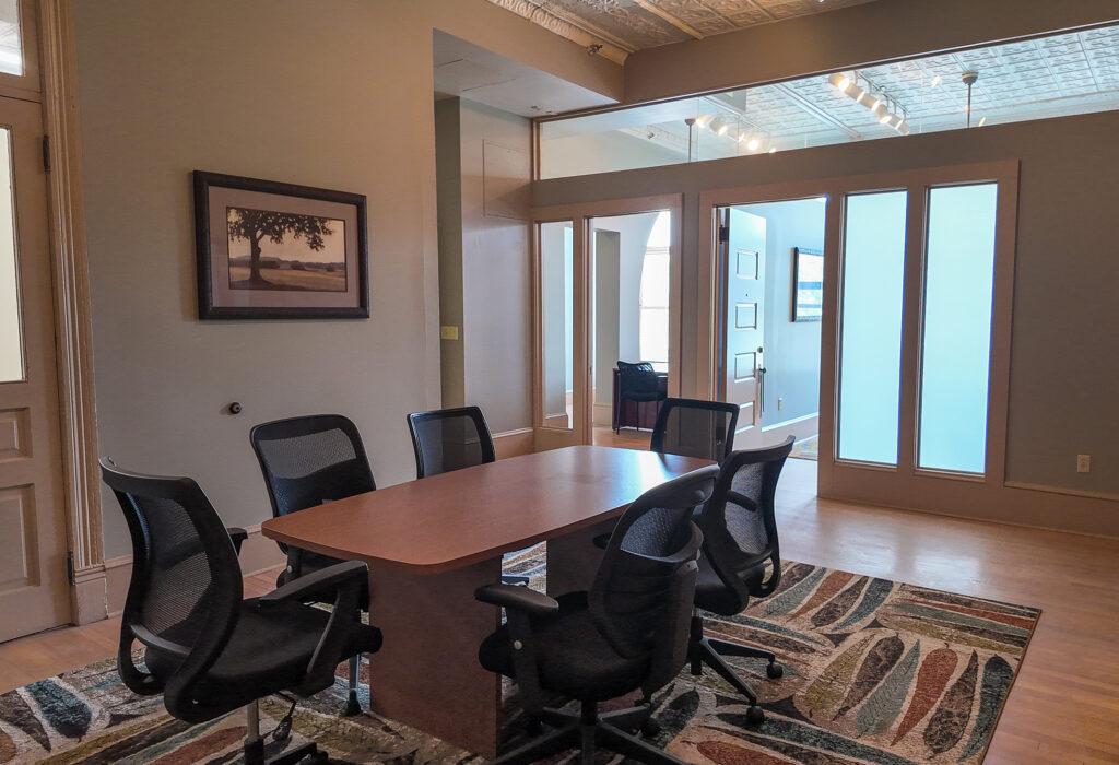 Conference space facing two private offices