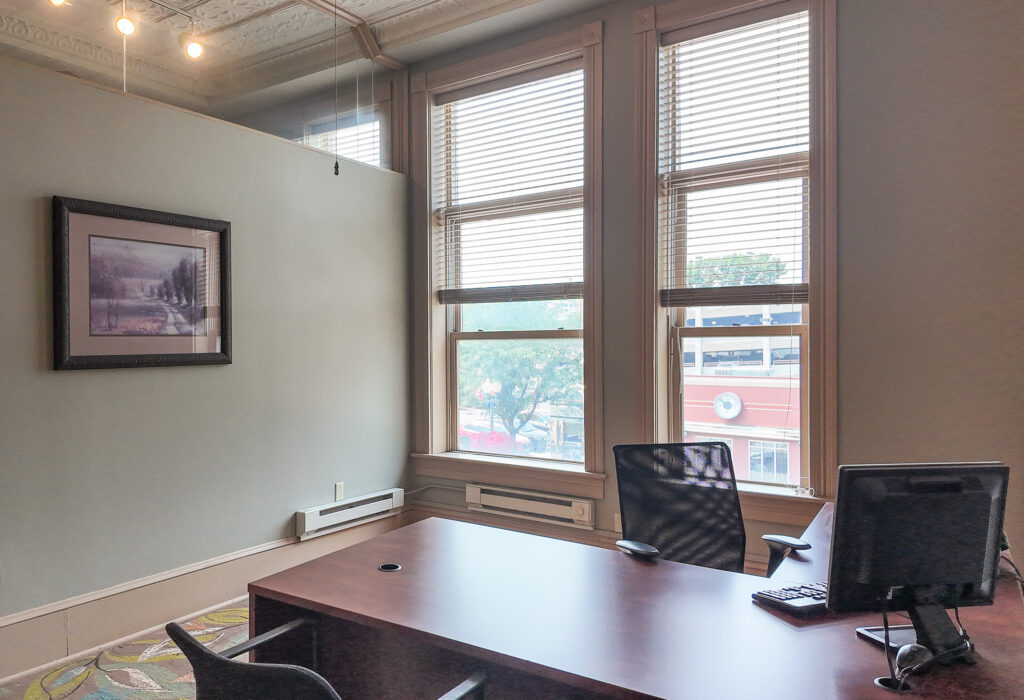 Private office with large windows and downtown views