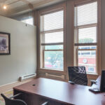 Private office with large windows and downtown views