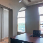 Private office with windows overlooking Phillips Avenue and historic arches