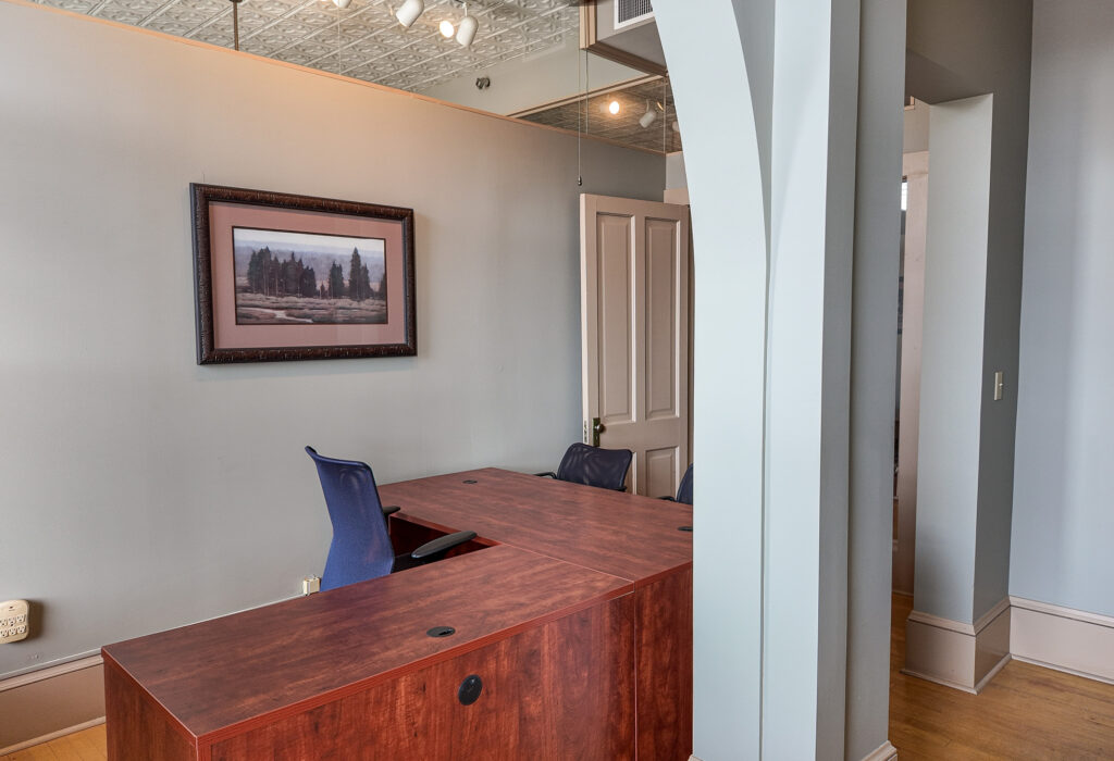 Private office with an L shaped desk