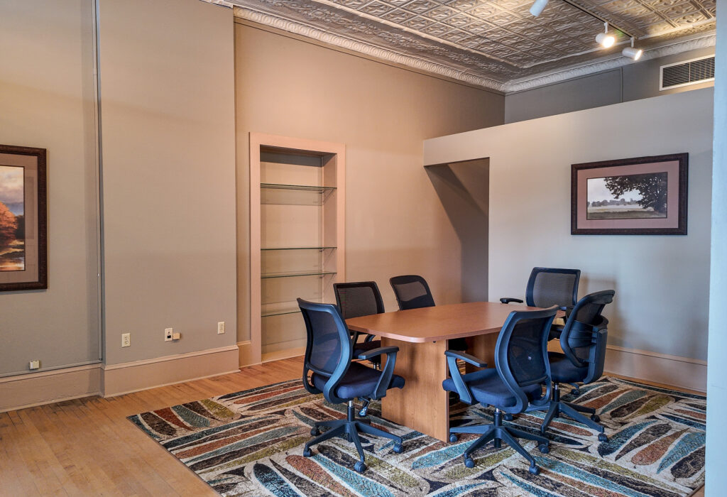 Open workspace with hardwood floors and historic architectural details