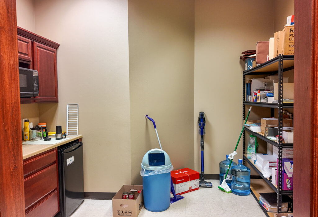 Break room with cabinetry and sink