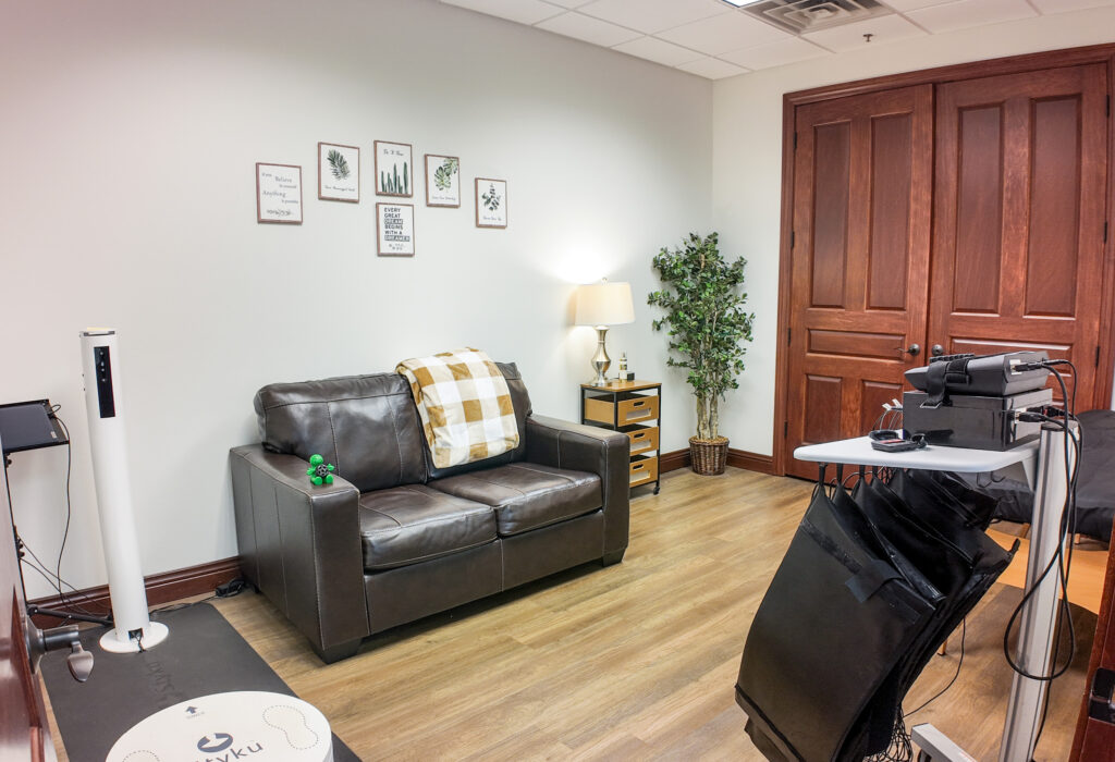 Private office with wood flooring and double doors
