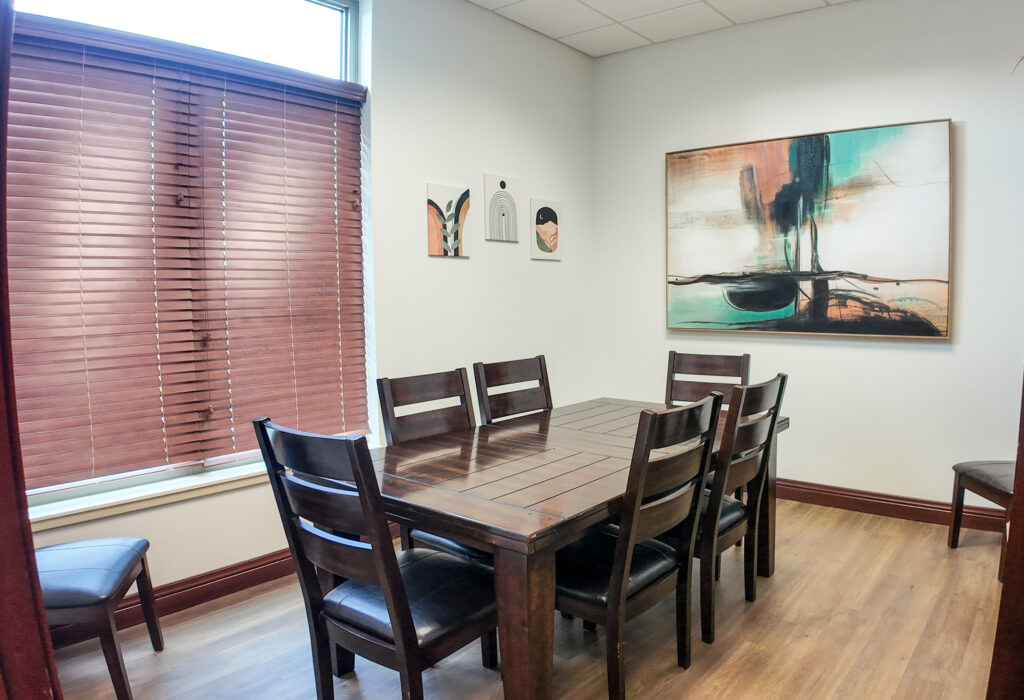 Break room with conference table and exterior window