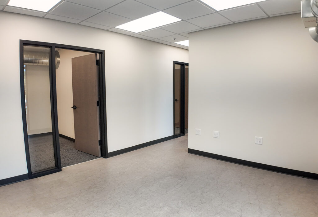 Finished office interior with private offices and glass sidelights