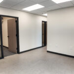 Finished office interior with private offices and glass sidelights