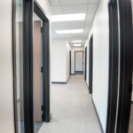 Interior hallway connecting private offices throughout Suite 120