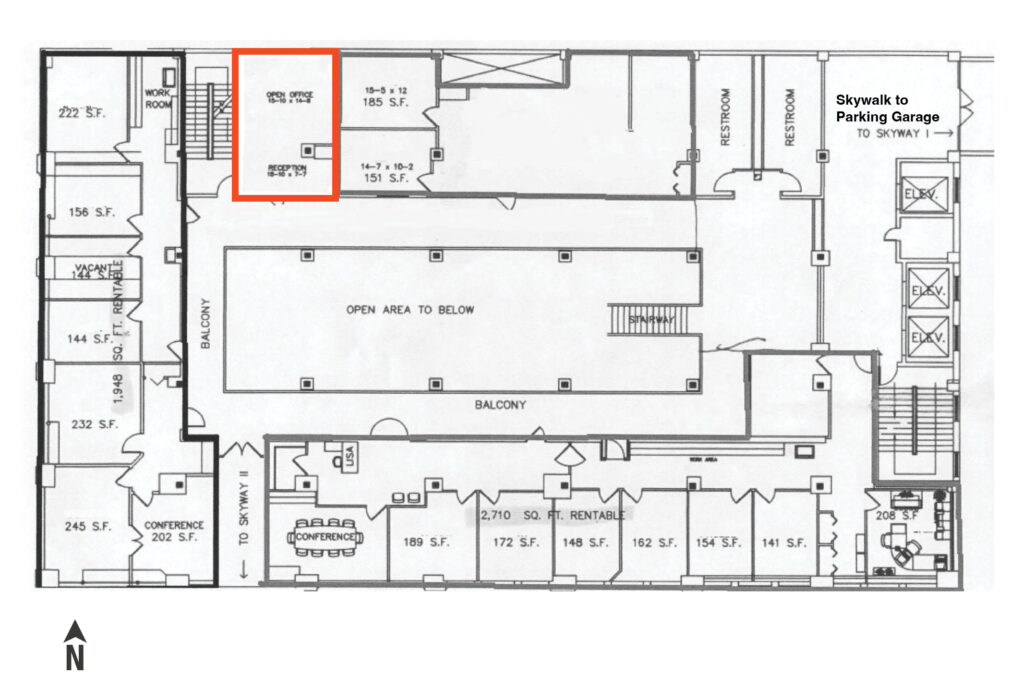 Second-floor plan with Suite 203 highlighted, showing the 345 SF +/- open area off the common corridor