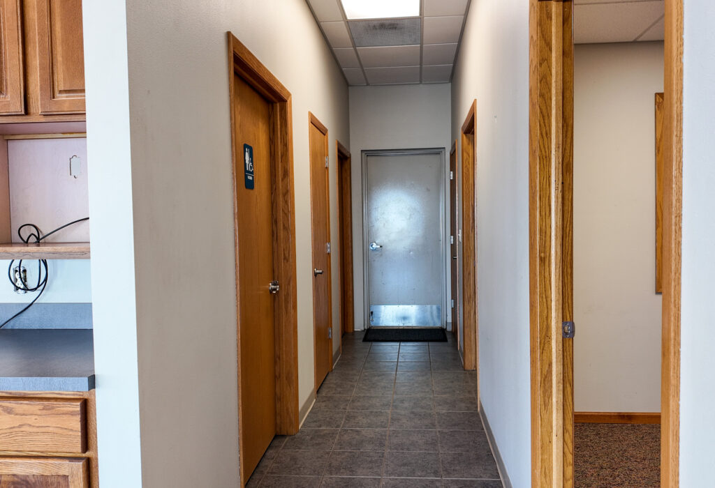 Interior hallway connecting offices and restrooms
