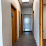 Interior hallway connecting offices and restrooms