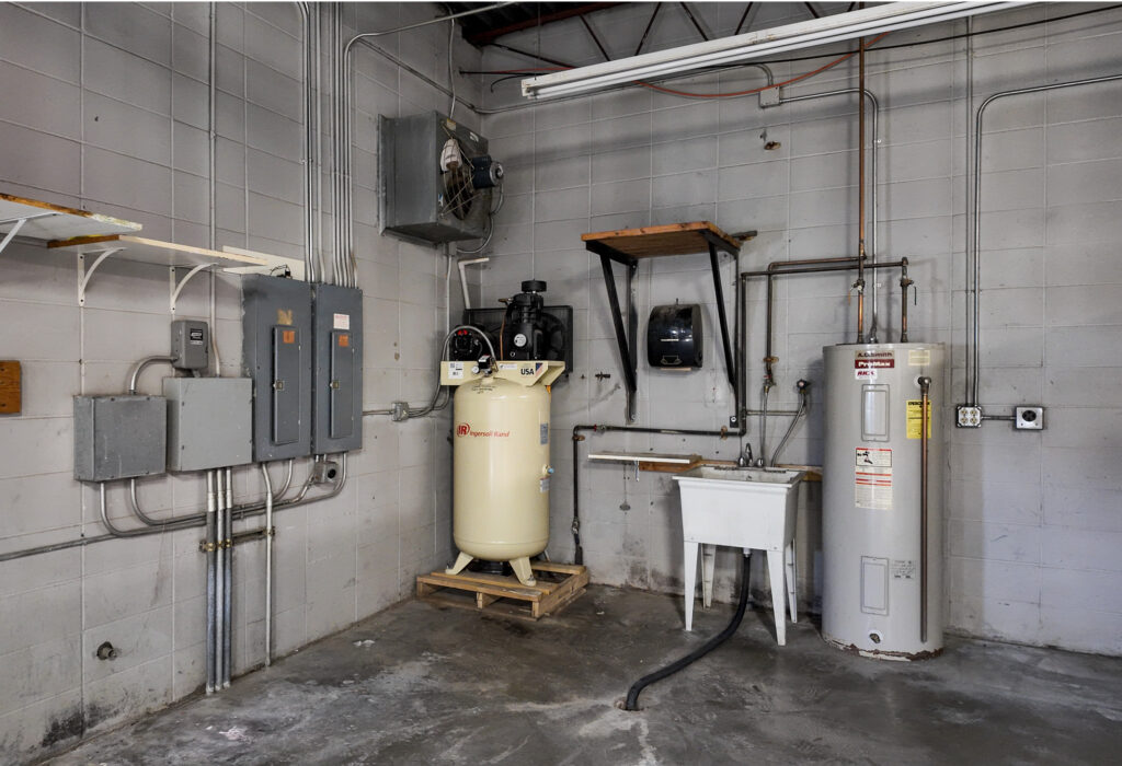 Shop utility area with sink and mechanical equipment