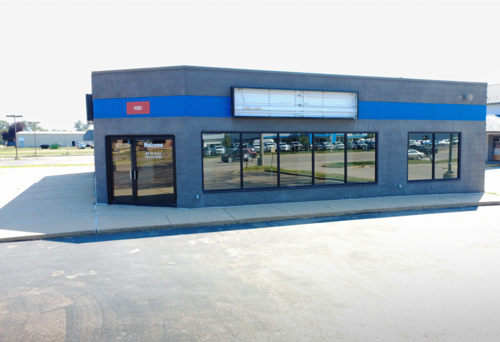 Front entrance and storefront windows at the West 12th Street flex building