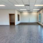 Open office and retail space with large storefront windows