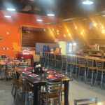 Restaurant dining area with booth and table seating